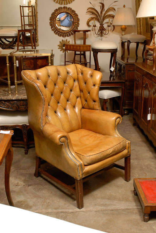 English tufted back leather chair with nail heads.