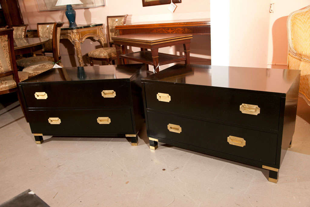 Pair of Custom Quality Baker Furniture Company Campaign Chests. Simple construction with very straight lines. The drawer pulls and foot caps all bronze. Each bearing the Millings Row Baker Stamp. Ebonized w a fine french polish.
