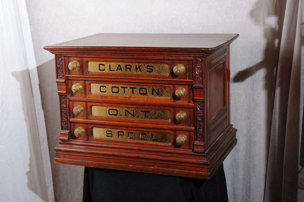 This cabinet was used for spools but now can be used as a side table or any other companion piece.  Beautiful carving and hardware bring the quality of this to another level.  Note the exquisite condition of the gold lettering, which is normally