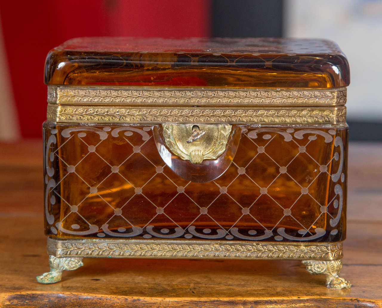 A 19th Century amber colored glass box with brass mounts and original key.