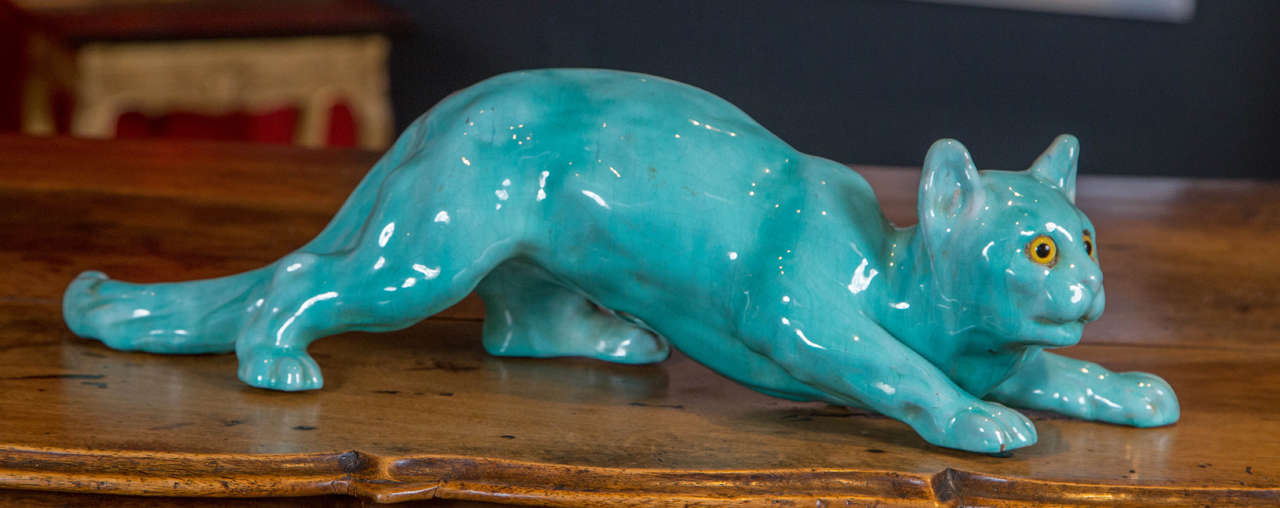 A 19th Century French turquoise colored Faience figure of a cat.