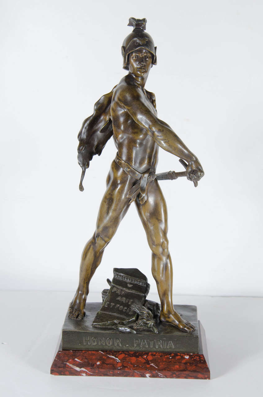 This stunning classical artwork by Emile-Louis Picault ( French 1833 to 1915) successfully captures the noble virility of his subject matter.This sculpture is finish din a rich bronze patina mounted on an exotic Red marble base.It is signed by the
