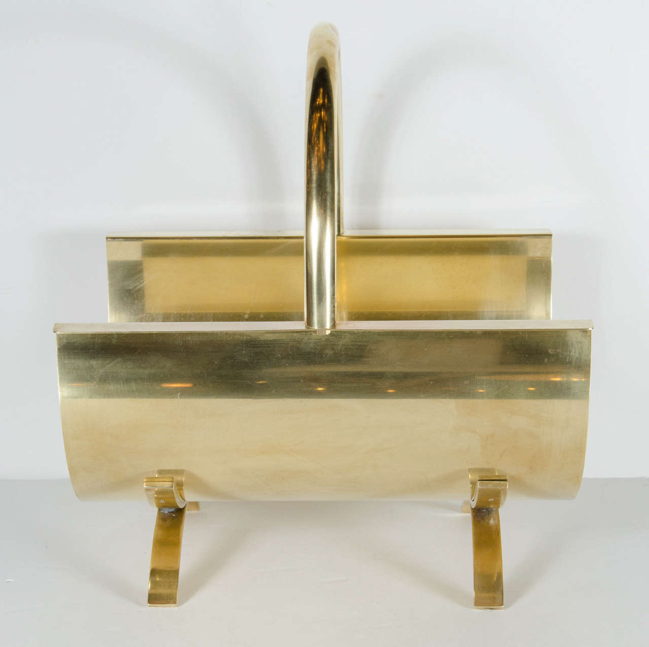 Mid-Century Modernist Brass Log Holder in the Manner of Adnet In Excellent Condition In New York, NY