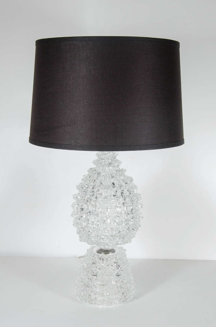 This pair of sophisticated Mid-Century Modern table lamps by Barovier & Toso feature bases made of clear Murano glass fashioned in irregular spikes arranged in concentric rows, cinched at the mid-point. New custom shades, chromed fittings and newly
