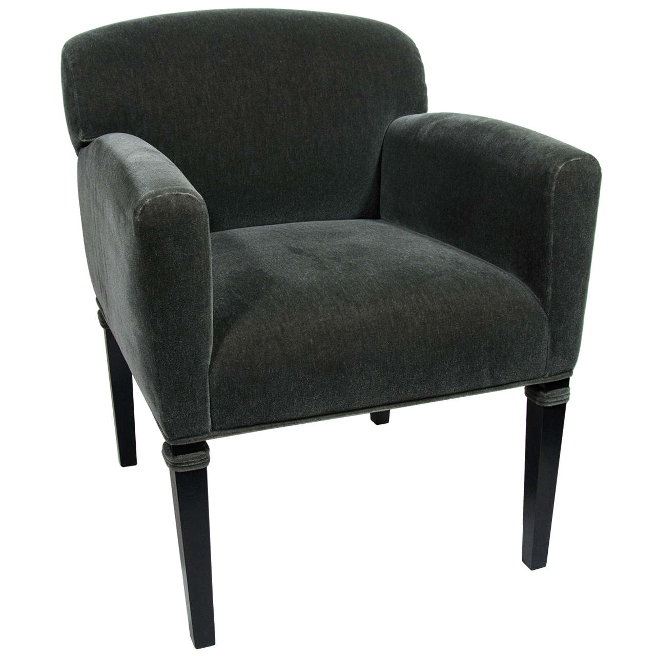 Gorgeous Art Deco style occasional chair with low back design and modern profile.  Upholstered in a luxurious green moss mohair with grey undertones. The chair has ebonized wood legs with a satin finish and features mohair trim piping near the tops