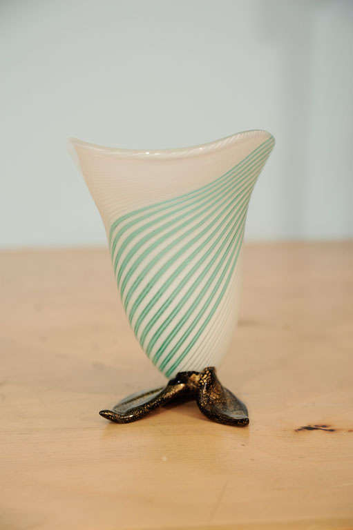 Handblown vase with pale green and white swirled stripes. Some gold to glass, and applied foot detail in dark glass.