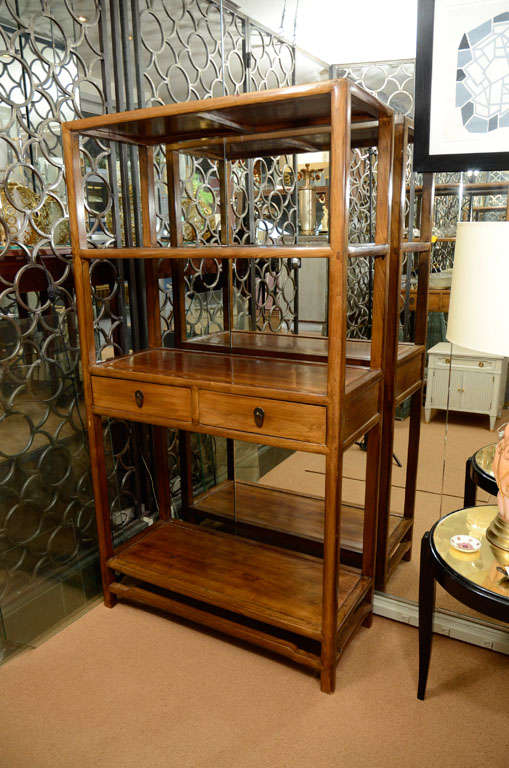 Polished fruitwood etegeres with an Asian inspired design. PRICE is PER Bookcase.