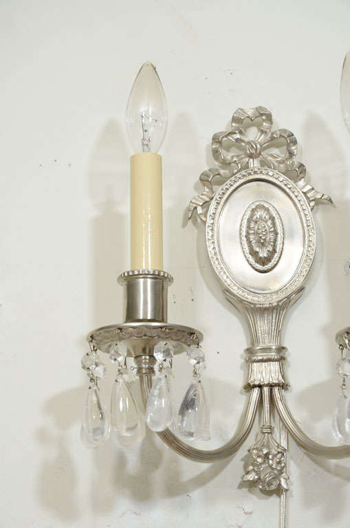 Hollywood Regency Pair of Hollywood Brushed Nickel & Rock Crystals Sconces w/ Neoclassical Details For Sale