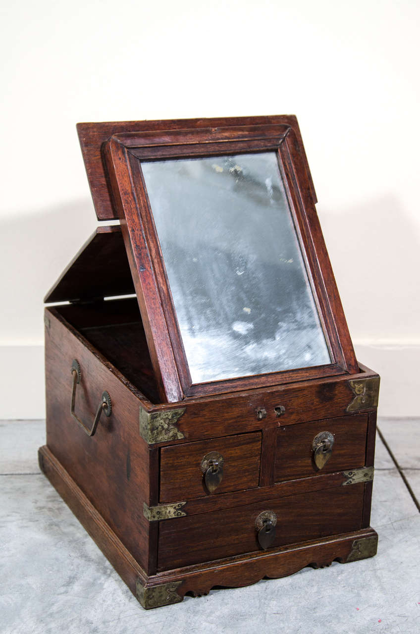 A charming antique rosewood jewelry box with original mirror.
China, Shanxi Province c. 1880.
BX418