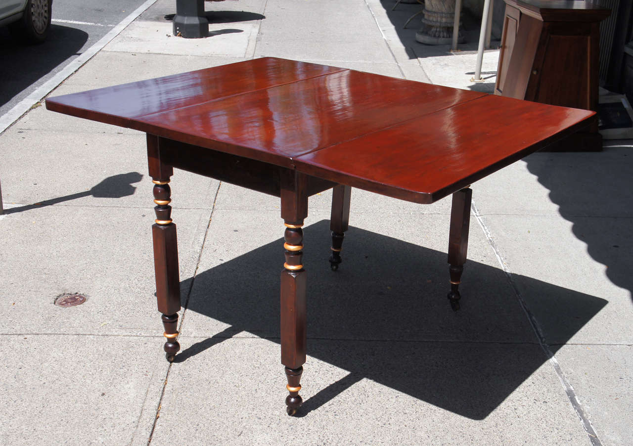 This table a chunky and masculine example of a form made in West Chester county and the Hudson Valley around 1830  and opens to a maximum size of 51 inches which is almost dinning size seating 6 comfortably. This form is associated with the area by