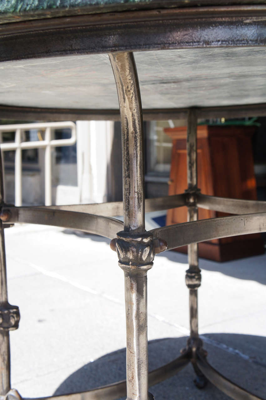 A Late 19th Century Polished Steel Marble Topped Center Table In Excellent Condition In Hudson, NY