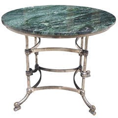 A Late 19th Century Polished Steel Marble Topped Center Table