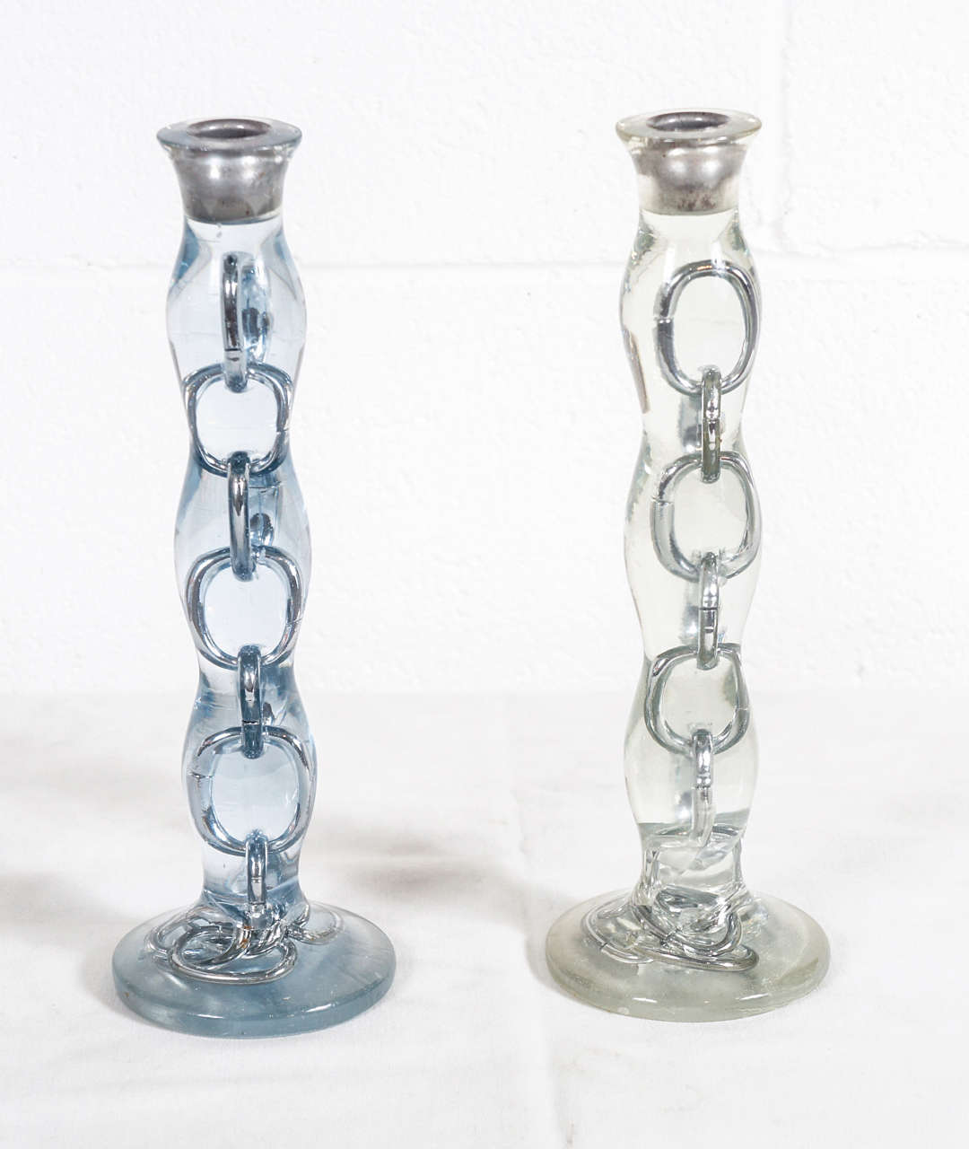 Here is a pair of chain link candlesticks cast in resin.