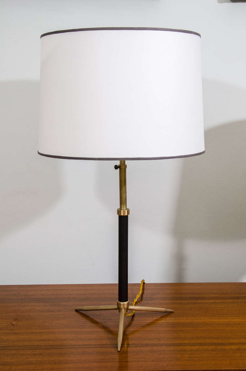 Brass table ;lamp by Jacques Adnet with new silk shade.