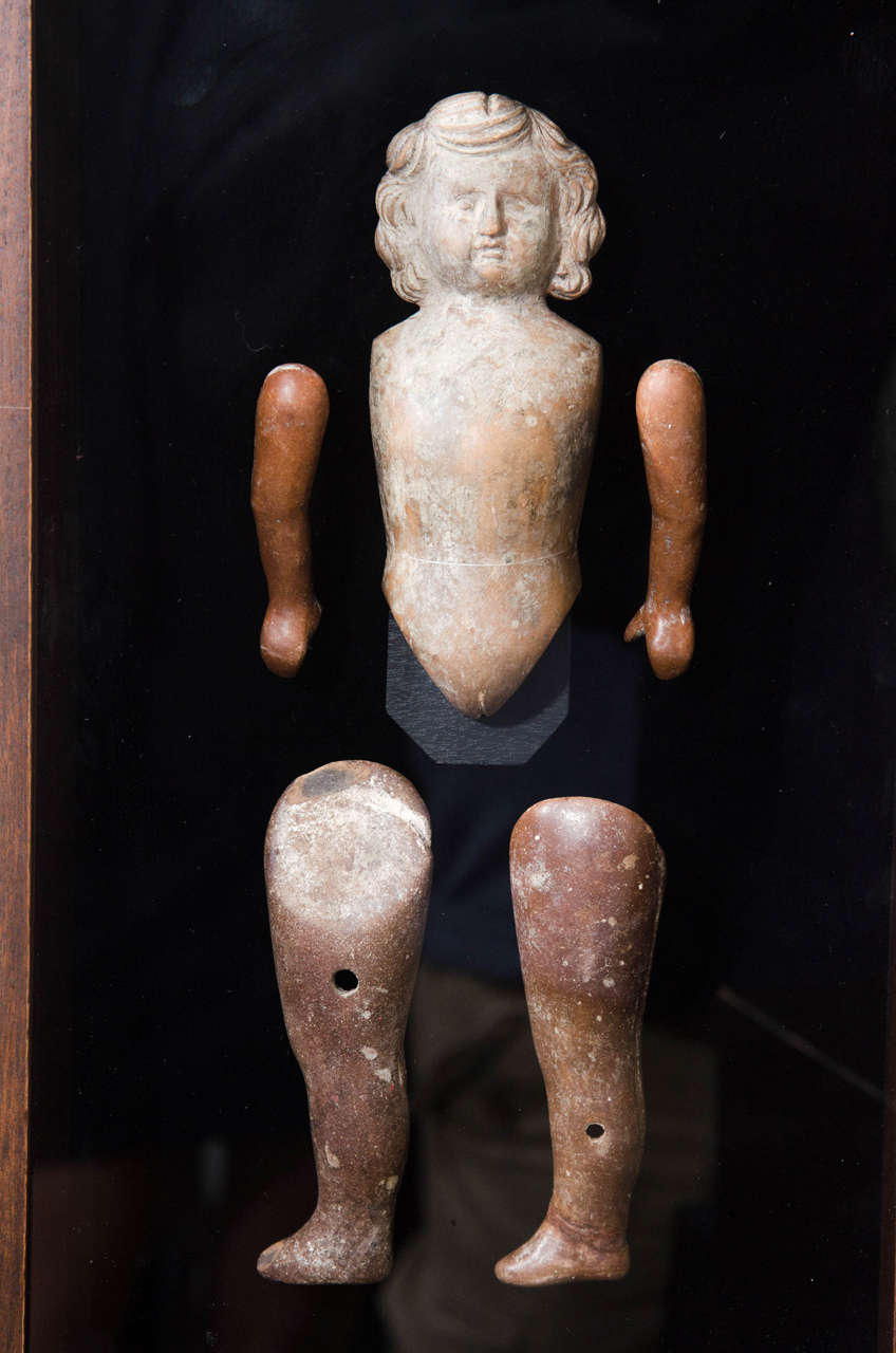 18th century Mexican terracotta doll statue in wooden shadowbox.