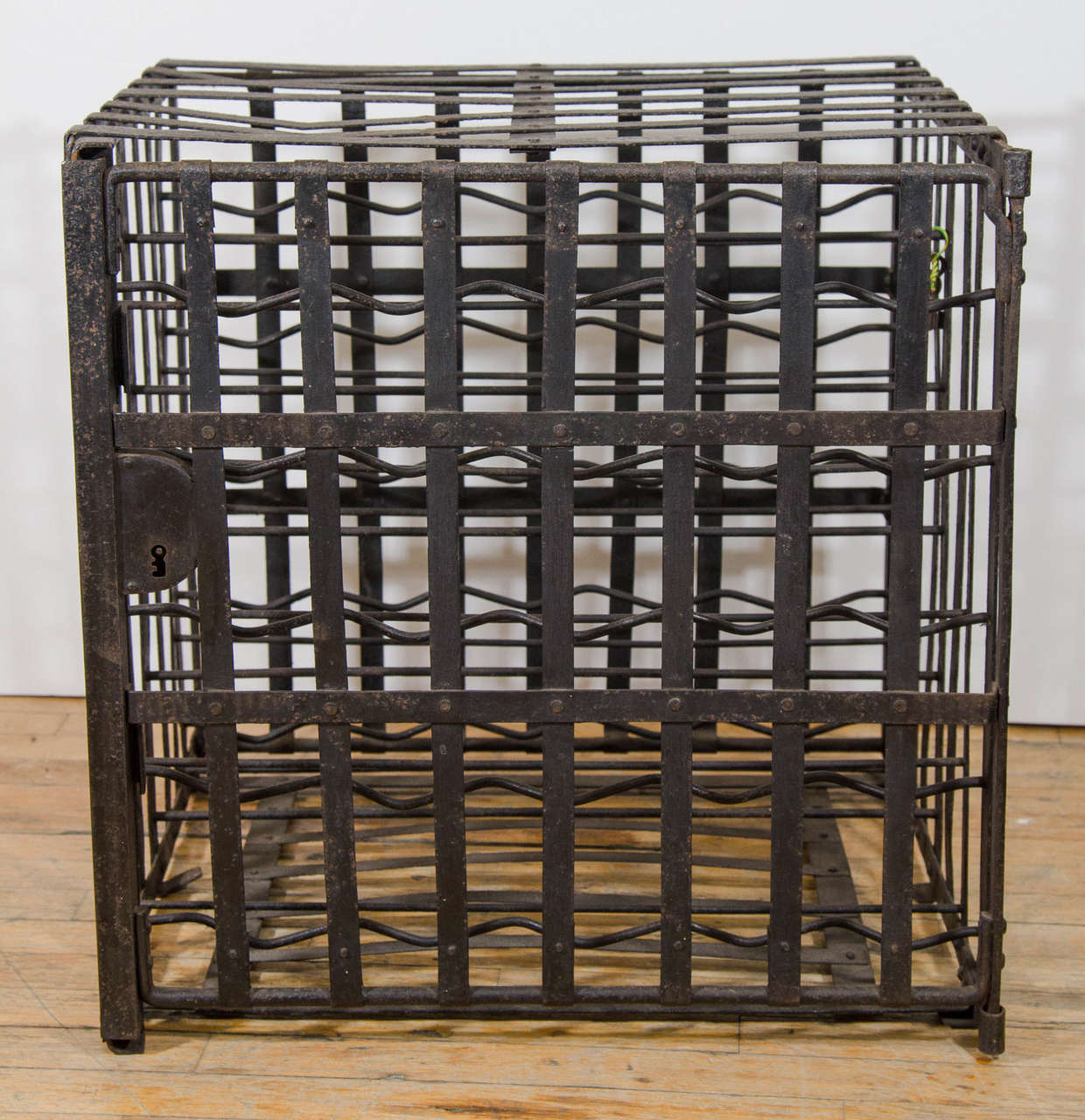 A 20th century iron cage form Industrial style wine rack from Germany.
Good vintage condition with age appropriate patina. Some rust spots.