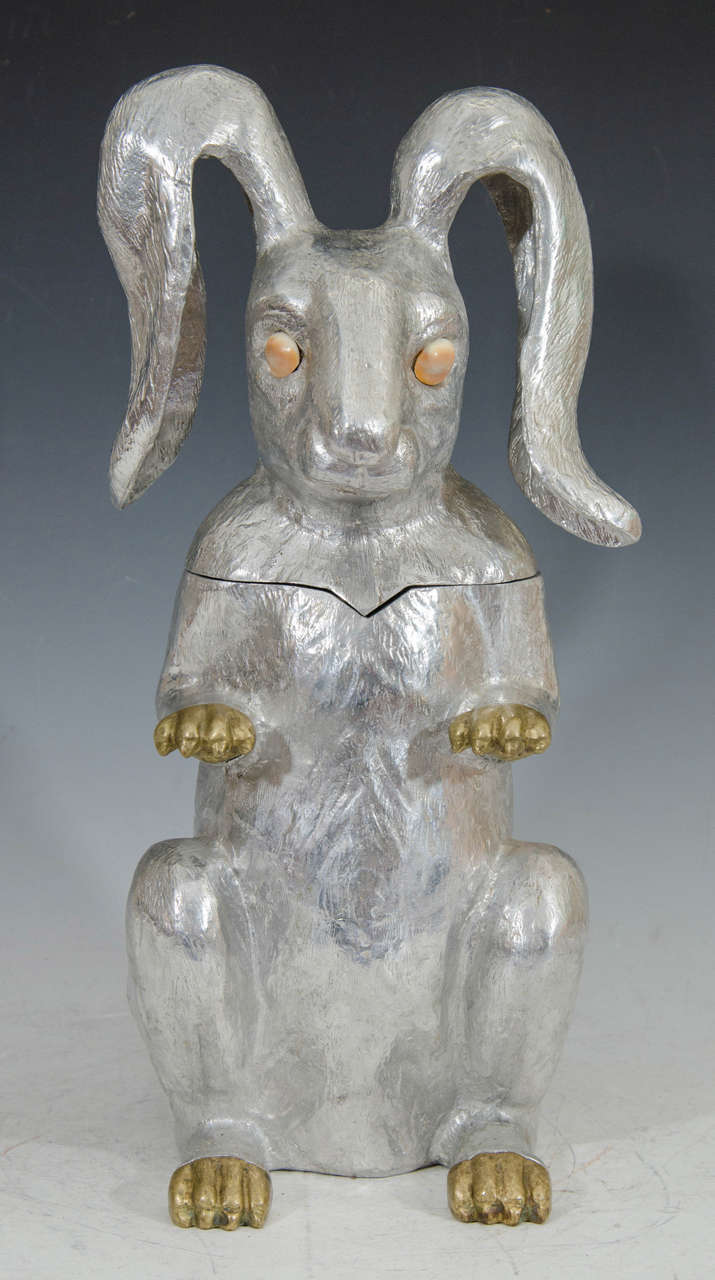 A vintage ice bucket or wine cooler in the shape of a rabbit. The piece is in cast aluminum with gold-tone paws and eyes. Stamped on the bottom.

Please see our other Arthur Court wine coolers, ice buckets, and serveware. We have elephants,