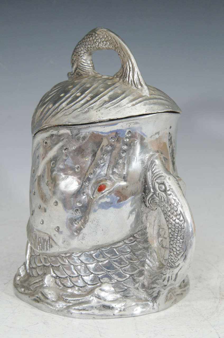 A vintage Arthur Court sculptural aluminum covered fish pitcher or ice bucket with red eyes. Stamped on the bottom.

Please see our other Arthur Court wine coolers, ice buckets, and serveware. We have elephants, dolphins, wild boar, whales,