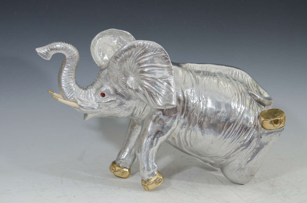 A vintage Arthur Court aluminum elephant ice bucket or wine cooler. The piece is stamped on the bottom.

Please see our other Arthur Court wine coolers, ice buckets, and serveware. We have dolphins, wild boar, sea lions, whales, rabbits, geese,