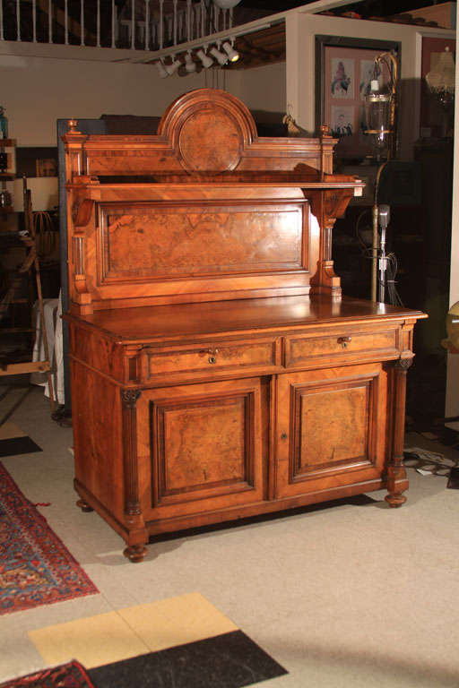 Beautiful burled walnut sideboard/buffet. Hand carved pillars, pullout serving tray.