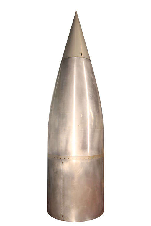Sporting the most amazing aerodynamic shape, these missile nose cones were purchased in a auction in New Mexico and date to 1947.  They are constructed out of spun steel with hinged nose tips.  In spite of their size they are an easy two-person lift