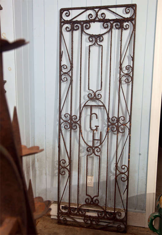 This classic English garden gate is made all the more interesting by its monogram 