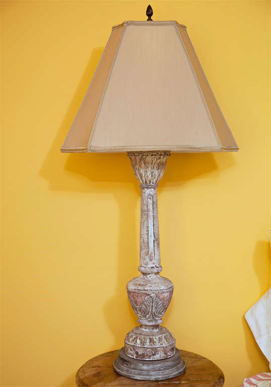 These are the most elegant wooden lamps we have ever owned. Beautifully and deeply carved, and with traces of distressed white and very faded red paint, these read very neutral and will work wonderfully with a wide variety of colors and decors.