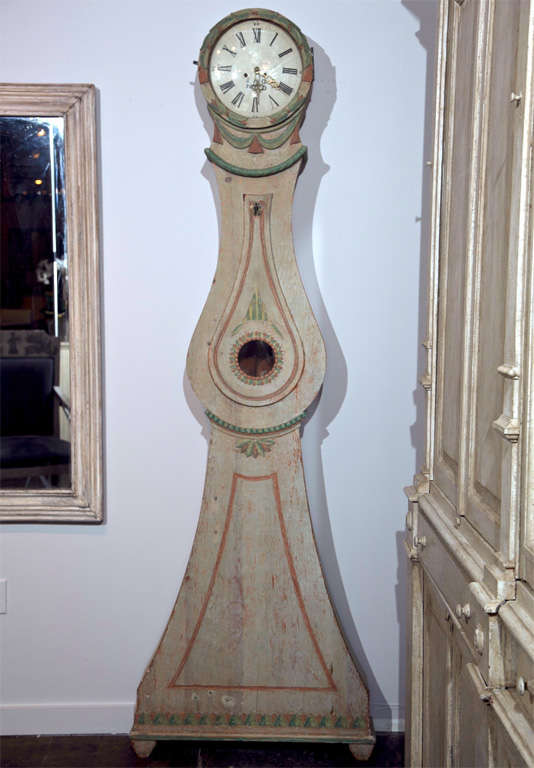 SWEDISH PAINTED PINE TALL CASE CLOCK, C. 1780, OF THE ROCOCO STYLE WITH CARVED AND POLYCHROMED CASE DETAIL, MORA MOVEMENT AND ORIGINAL PAINT DECORATION