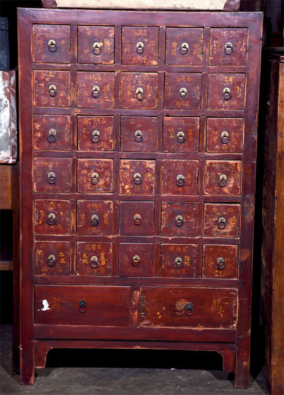 Chinese apothecary cabinet, c. 1880, from an herbal pharmacist in the Shanxi province having original calligraphy to the drawer fronts and original brass handles. One of a rare pair but priced and sold individually.