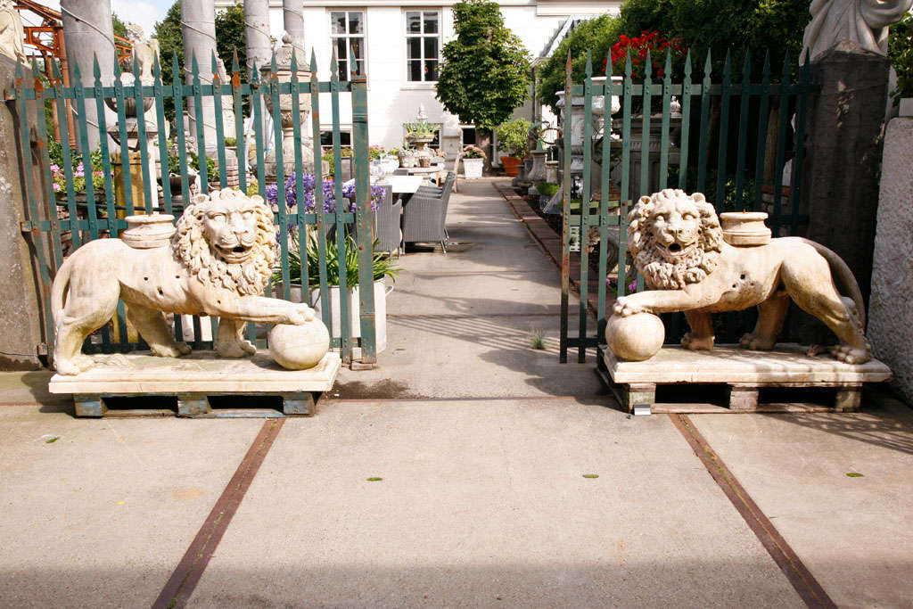A pair of carved marble lions, modelled as Romanesque column supports
