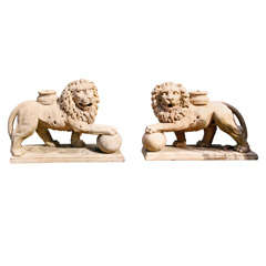 A pair of carved marble lions