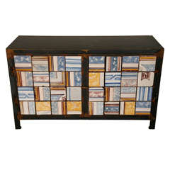 A modern metal sideboard, inlaid with 17th century Portugese tiles