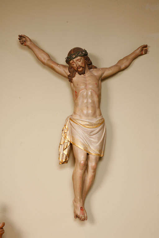 A large 20th century carved and polychrome painted wooden figure of Jesus