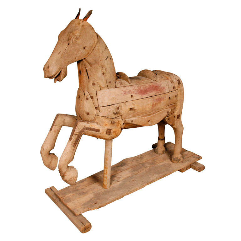 A 19th Century Continental carved wood fairground horse