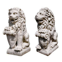 A pair of Italian carved marble lions