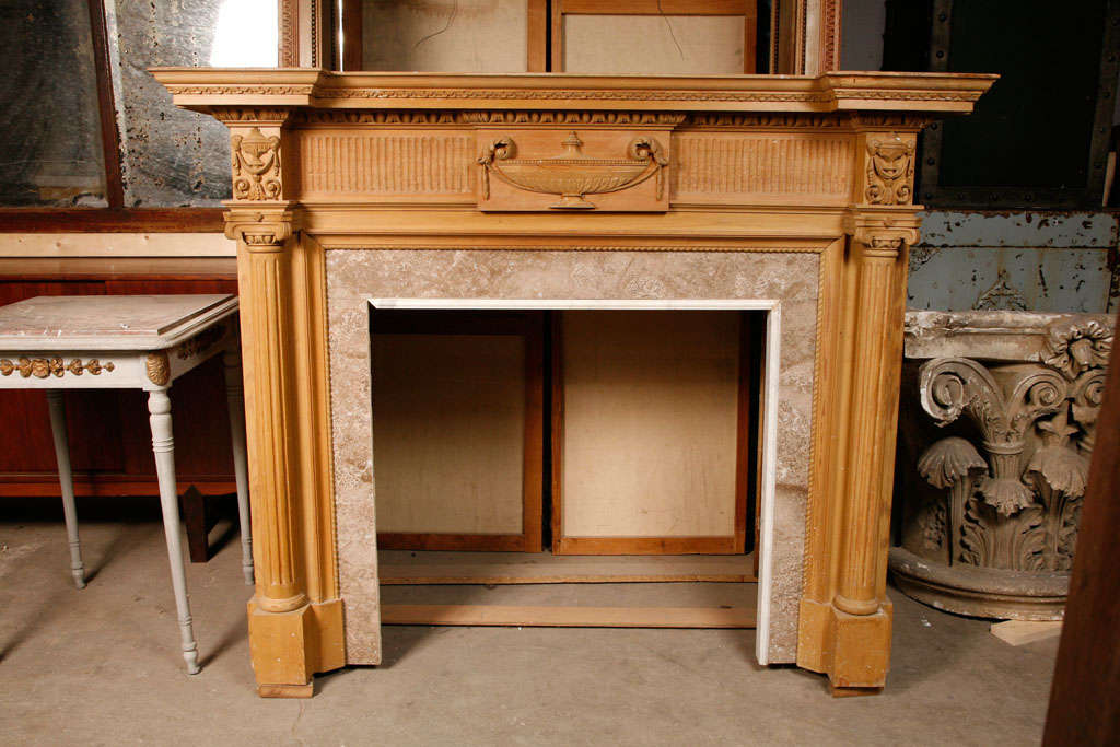 A 19th C. French carved pine fireplace / mantel piece in Neoclassical