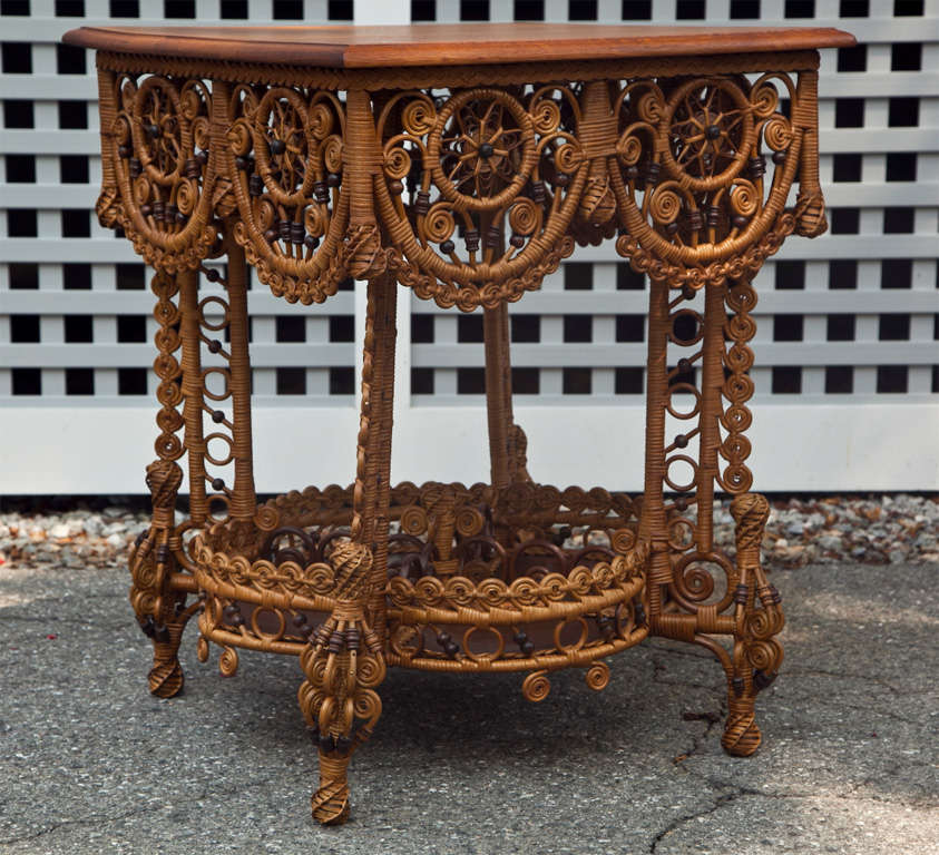 Spectacular Victorian wicker table professionally restored to original condition. A rare and wonderful one-of-a kind piece.