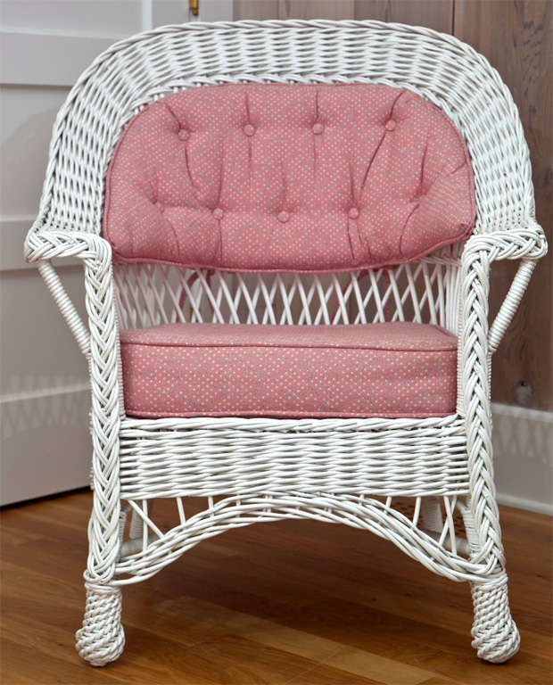 Antique Bar Harbor Wicker Chair with woven seat and feet in white paint.