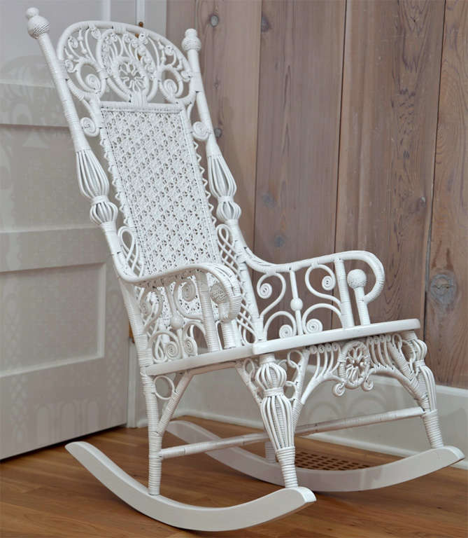Antique Victorian  Wicker Rocker with intricate design in white paint.
