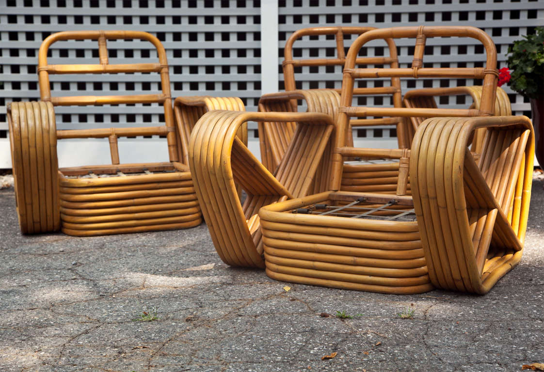 Six banded pretzel rattan lounge chairs in original finish.