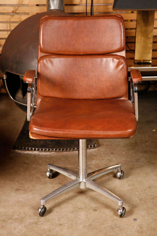 In the style of Eames; but actually more elegant. Very beautiful tanned leather softpad deskchair on wheels. Belgian manufacturer 