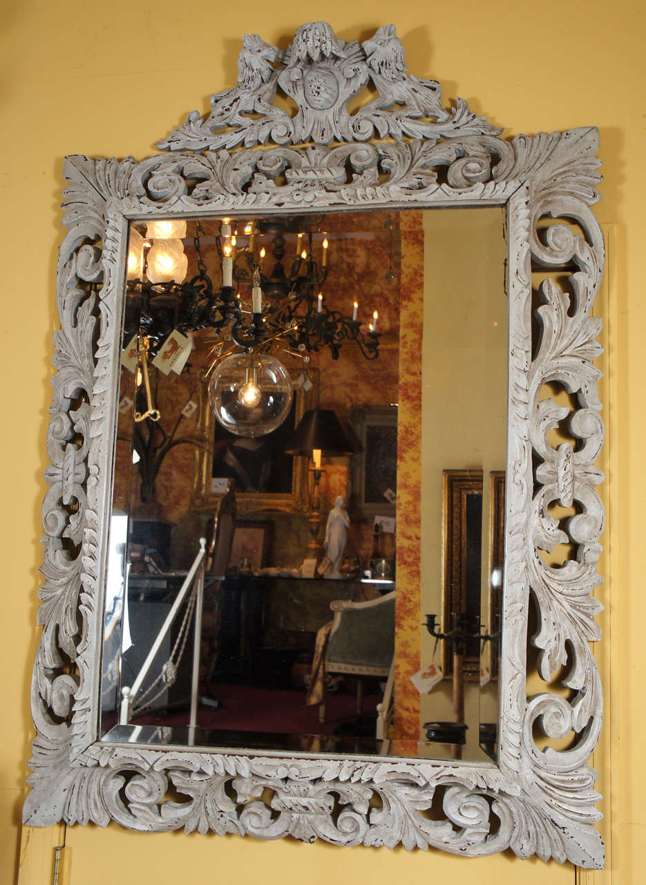 A Carved French Mirror from Normandy with a white wash.