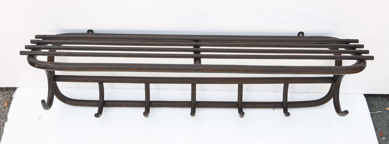 Thonet wall rack with shelf and seven hooks for coats.  Bentwood, original finish and sticker still intact.

Profits from this sale will go to Lange Foundation in Los Angeles.
Lange Foundation is a non-profit organization dedicated to saving