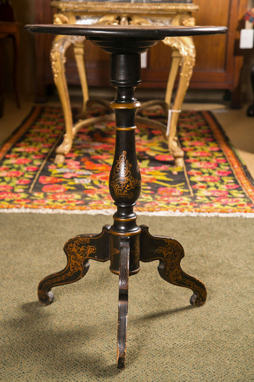 An ebonized and painted regency period tripod table with Italian specimen top.