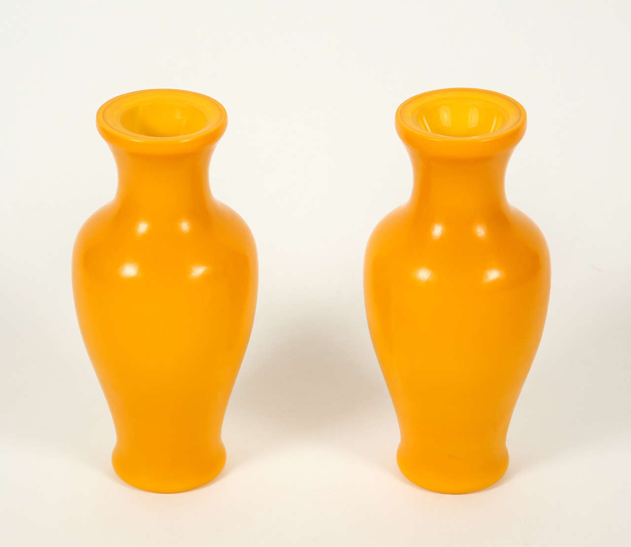 Lovely pair of yellow Peking glass vases.  Multi layered firing visible on the top.  Excellent condition, circa early 20th Century. Sold as a pair. 8 1/4