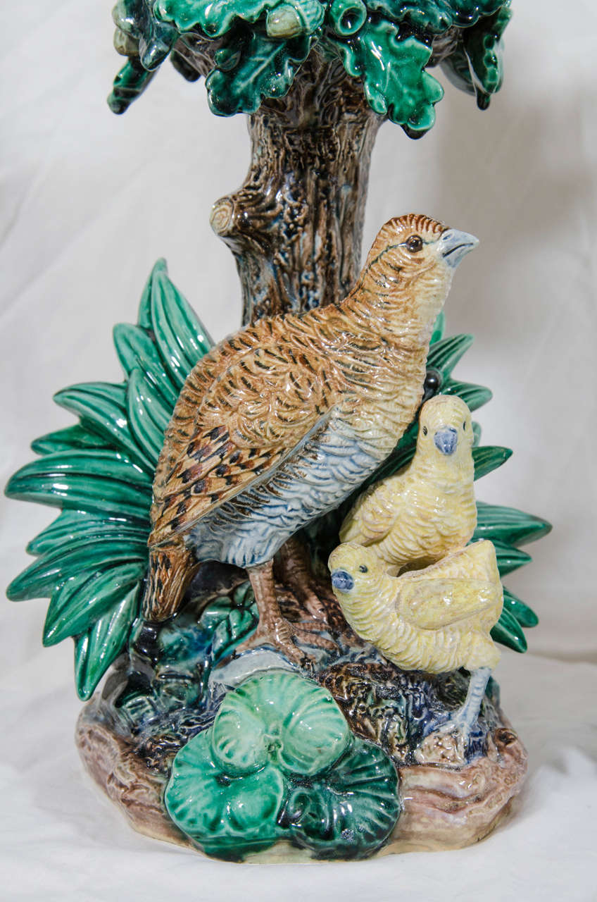 A Hugo Lonitz Majolica two part centerpiece which features partridges in front of reeds and an oak tree. Deep green, brown, and cream, are the predominant colors. This realistic depiction of nature is a masterpiece of majolica.
 So lifelike that as