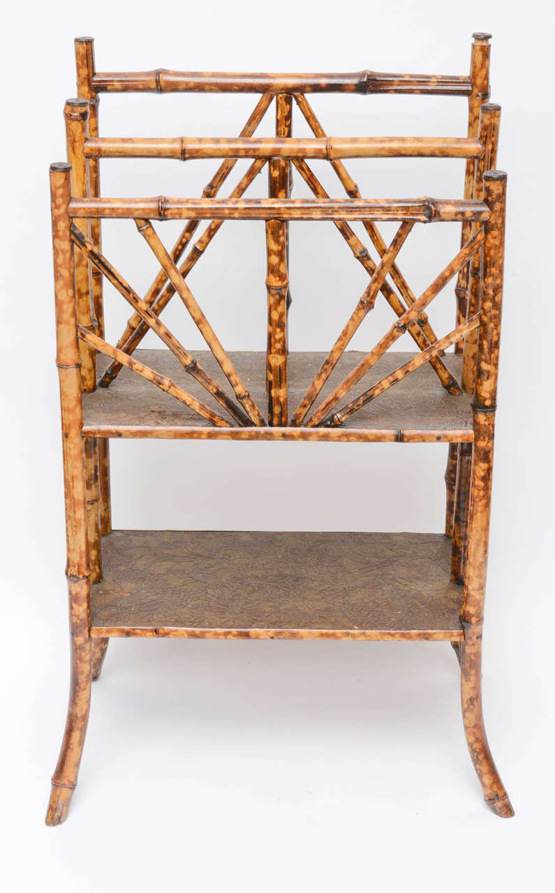 19th century English bamboo Canterbury (magazine rack) with beautiful bamboo and original tooled paper.