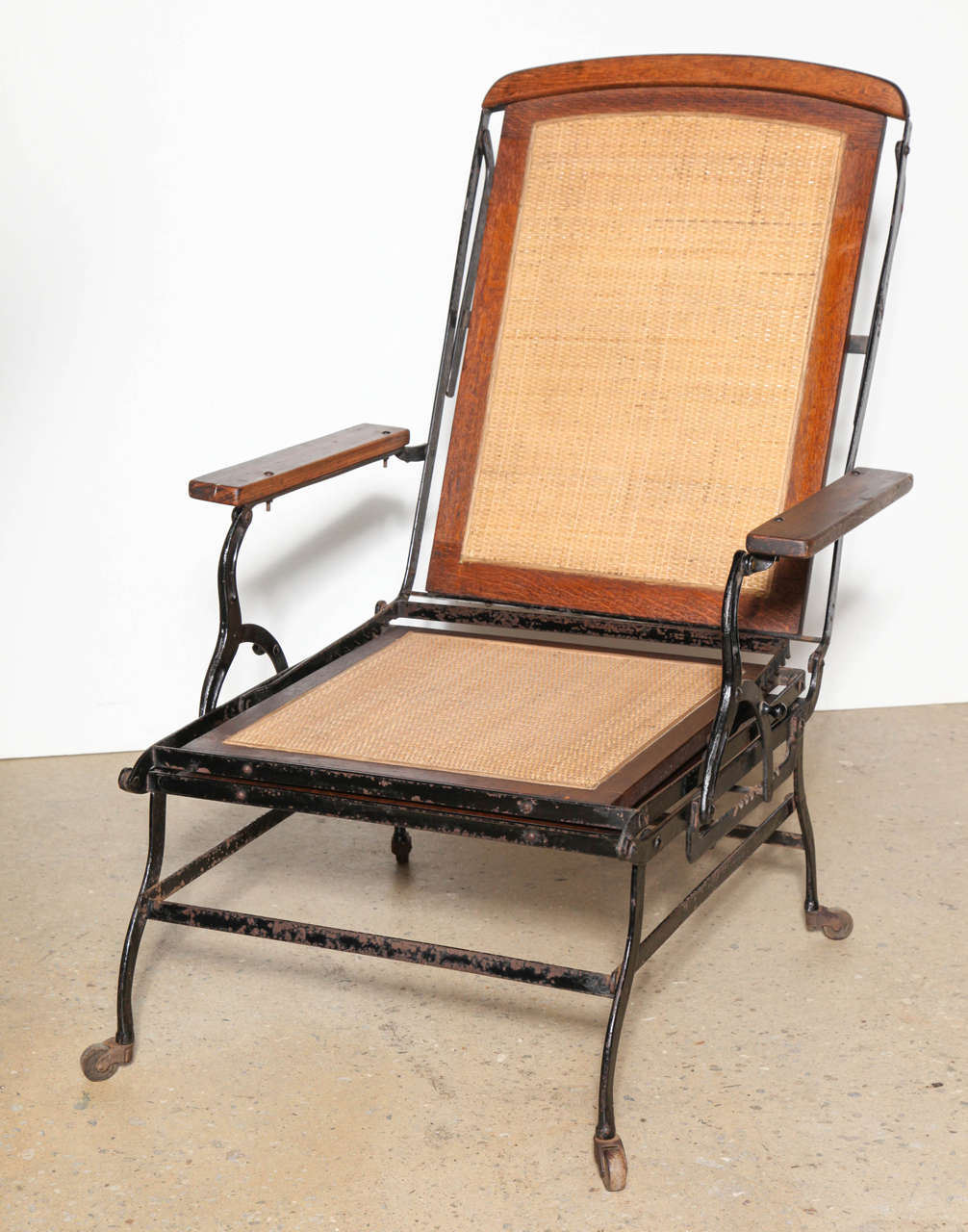 American Cevedra Sheldon Walnut, Cane & Cast Iron Rolling Chaise Lounge Chair, C. 1876