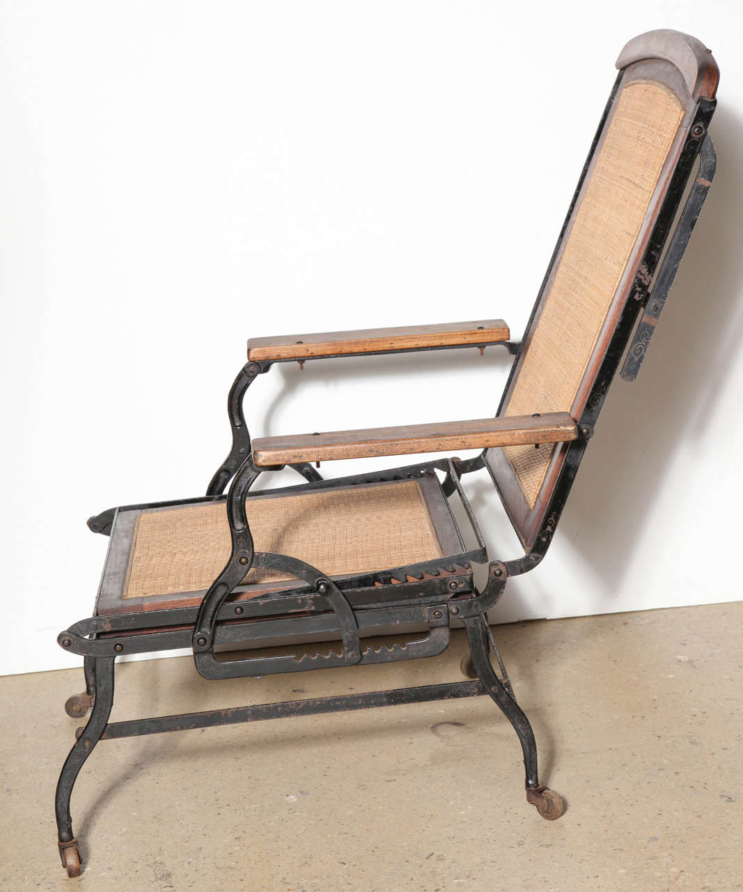 Cevedra Sheldon Walnut, Cane & Cast Iron Rolling Chaise Lounge Chair, C. 1876 In Good Condition In Bainbridge, NY