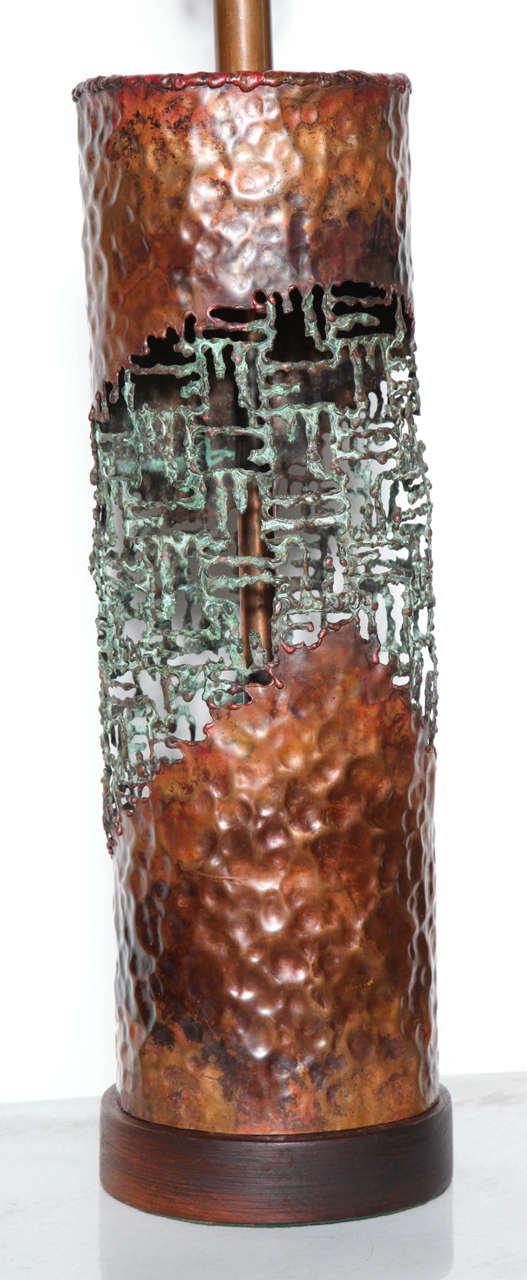 Large Marcello Fantoni for Raymor handcrafted Copper and Verdigris Torch Cut Table Lamp, 1950's. Featuring an open fretwork cylindrical form with pierced, hammered, Torch Cut Copper and Verdigris. Copper neck. Circular wooden base. Made in Italy. 